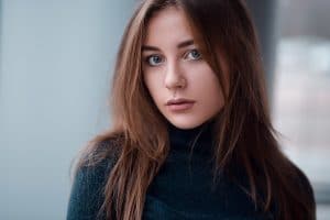 Portrait close up of a glamour young Russian woman with long hair and big eyes